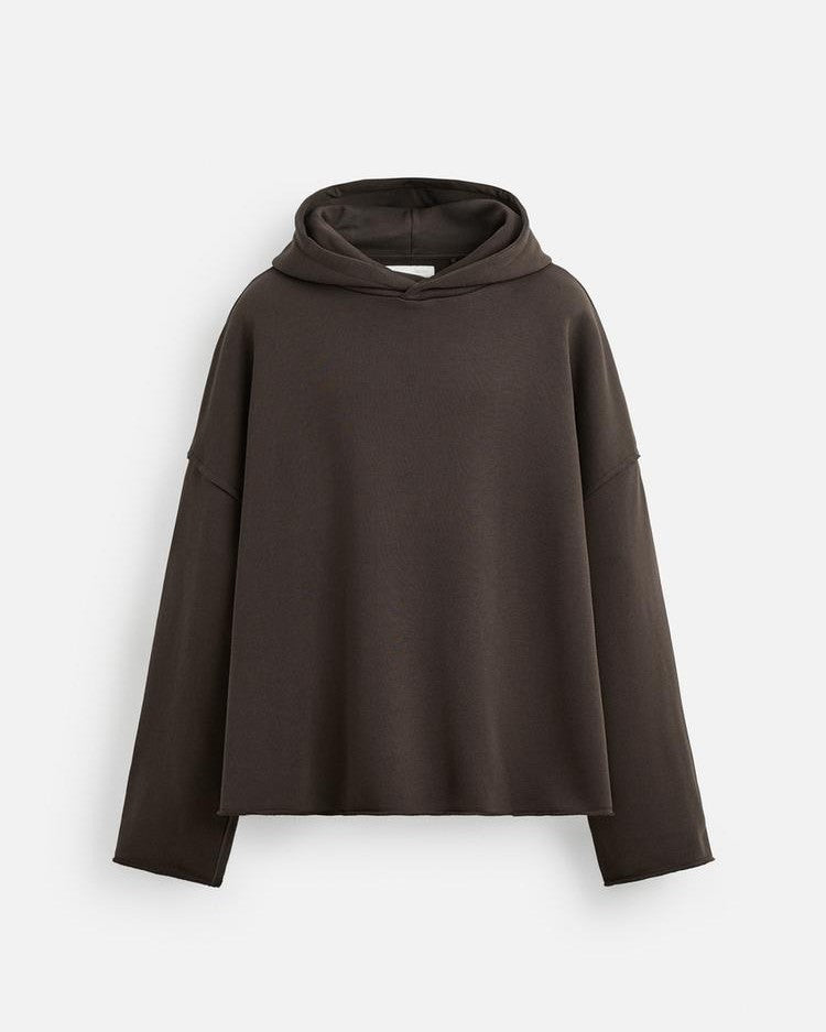 Brown hooded cape on a white background